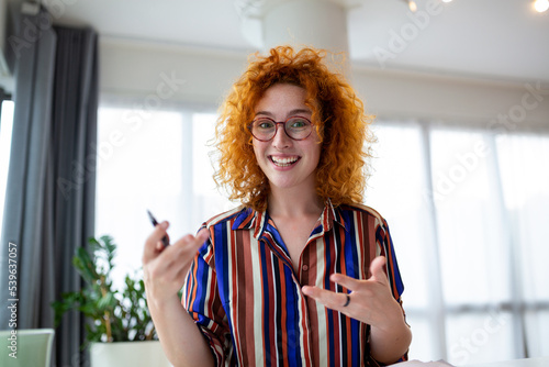 Shot of a businesswoman on a video call while sitting at her desk.Cropped shot of an attractive young woman using her laptop to make a video call at home