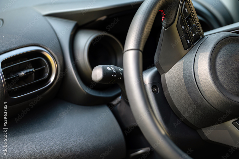 Interior view car with modern steering wheel, dashboard. Closeup. Shallow depth of field Interior view car with modern steering wheel, dashboard. Closeup. Shallow depth of field