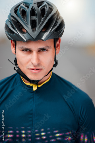 Cycling, helmet and serious with a sports man outside, ready to ride or cycle for exercise and fitness. Workout, training and cardio with a male athlete riding with focus for health or endurance © Beaunitta Van Wyk/peopleimages.com