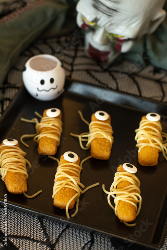 Halloween party.  Eyes  fish finger with spagetti. Halloween decorations Halloween food concept