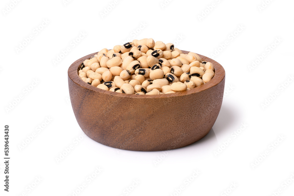 White cow pea beans (Black eye bean) in wooden bowl isolated on white background with clipping path. White cow pea beans (Black eye bean) in wooden bowl isolated on white background with clipping path.