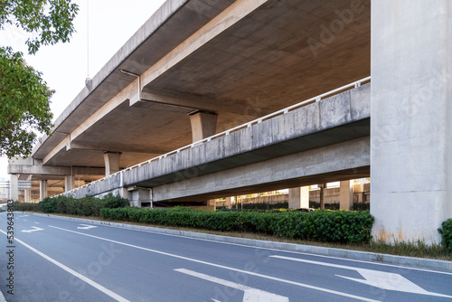 Concrete structure and asphalt road space under the overpass in the city © gjp311
