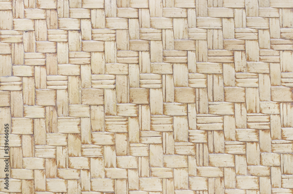 Old bamboo weaving pattern, woven rattan mat texture for background and design art work.