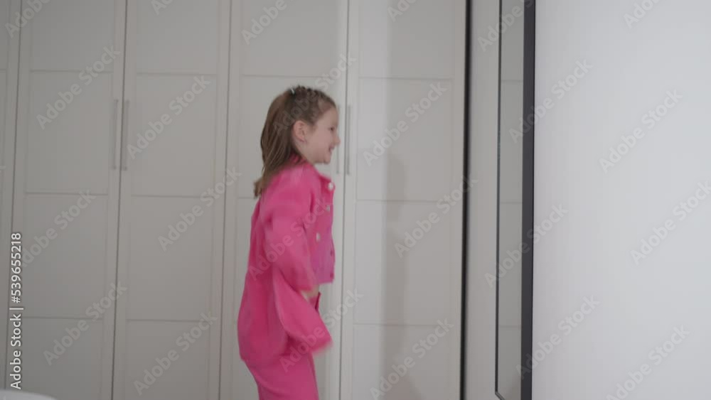 Arrogant little girl dancing in front of mirror Arrogant little girl dancing in front of mirror