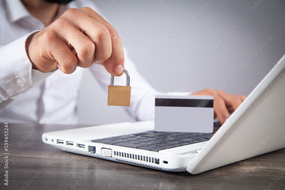 Man showing padlock. Credit card, internet, computer security Man showing padlock. Credit card, internet, computer security