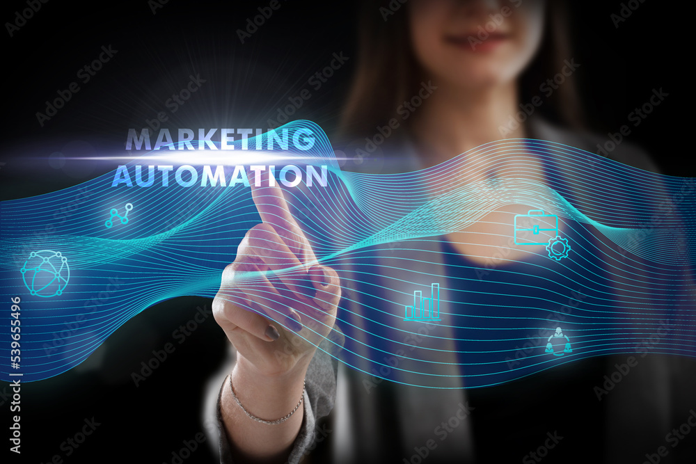 Business, Technology, Internet and network concept. Young businessman working on a virtual screen of the future and sees the inscription: Marketing automation Business, Technology, Internet and network concept. Young businessman working on a virtual screen of the future and sees the inscription: Marketing automation