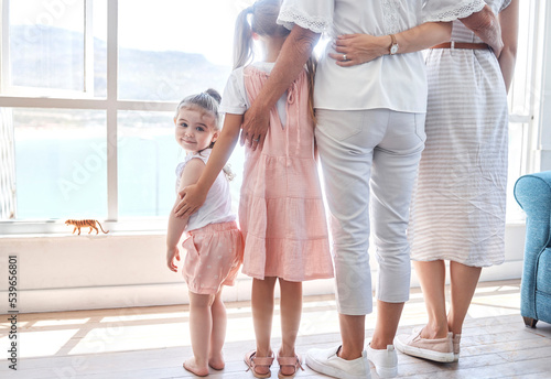 Photography Women, children and generations, rear view at window, back legs and toddler girl looking with smile