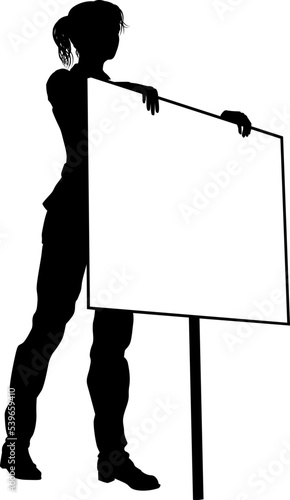 Protestor or demonstrator at a demonstration march, picket line or strike protest rally in silhouette. Holding up a banner or picket sign board placard.