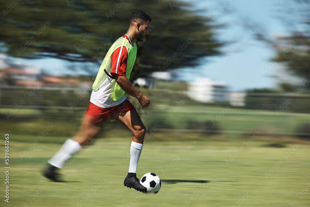 Soccer, sports and man athlete in a football game on sport field running fast and kick in nature. Fitness, training and health exercise of a workout match run with a player energy and motivation