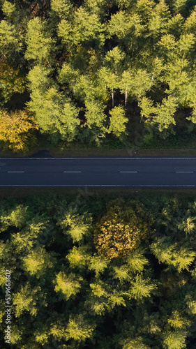 vertical photo of road with cars photo