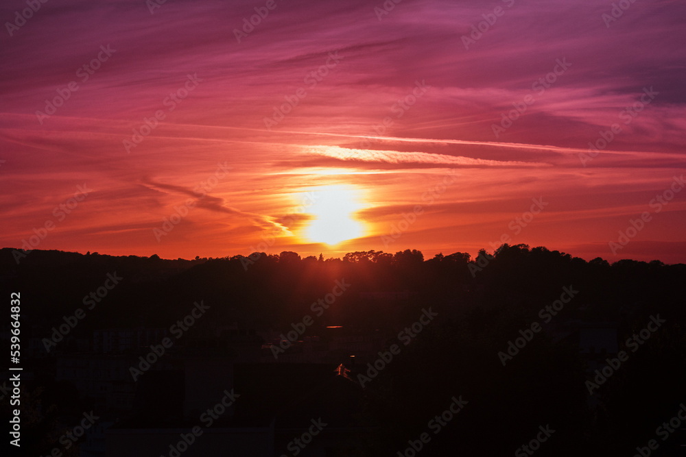 Fototapeta premium An amazing sunset over the city