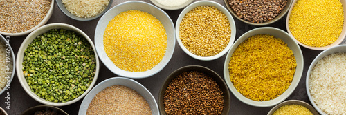 Various grain cereals in bowls banner, top view