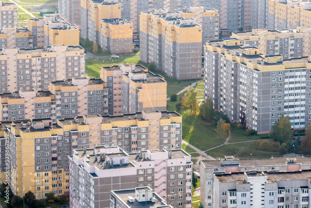 aerial panoramic view from height of a multi-storey residential complex and urban development in autumn day