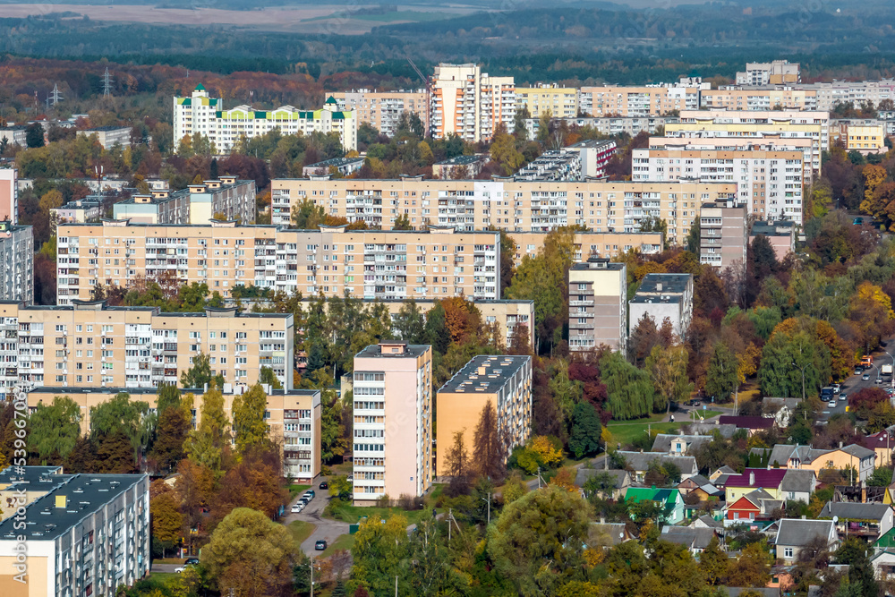 aerial panoramic view from height of a multi-storey residential complex and urban development in autumn day