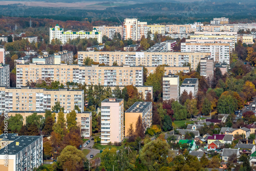 aerial panoramic view from height of a multi-storey residential complex and urban development in autumn day