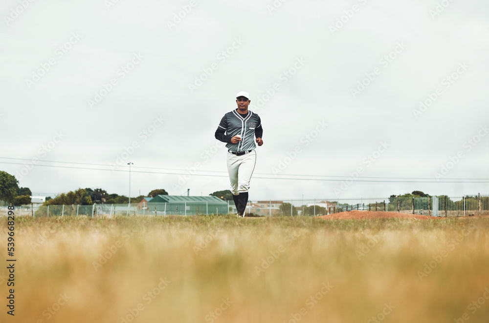 Baseball player running on a baseball field for training, sport and fitness in physical, competitive game. Sports, health and baseball with a man athlete at the start of a match on a field outdoors Baseball player running on a baseball field for training, sport and fitness in physical, competitive game. Sports, health and baseball with a man athlete at the start of a match on a field outdoors