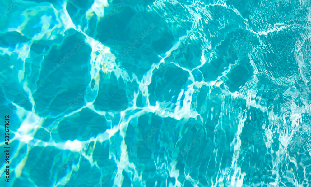 blue color background of swimming pool water with ripples in caribbean blue color background of swimming pool water with ripples in caribbean