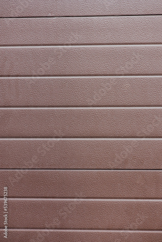 The plastic exterior siding on automatic garage doors closes up