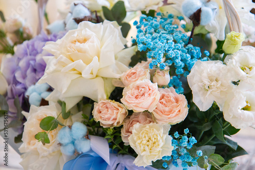 a bouquet of flowers in delicate shades of pink, purple, beige and blue