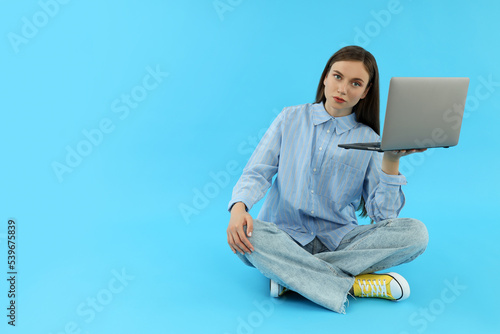 Concept of people, young woman on blue background