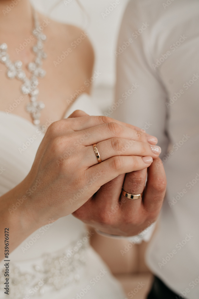 Hand in hand. Romantic background with rings. Hugs of lovers Hand in hand. Romantic background with rings. Hugs of lovers
