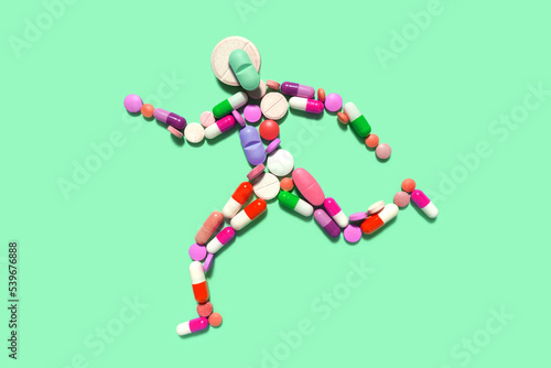Creative medicine health sport concept photo of man person made of pills drugs running for doping.