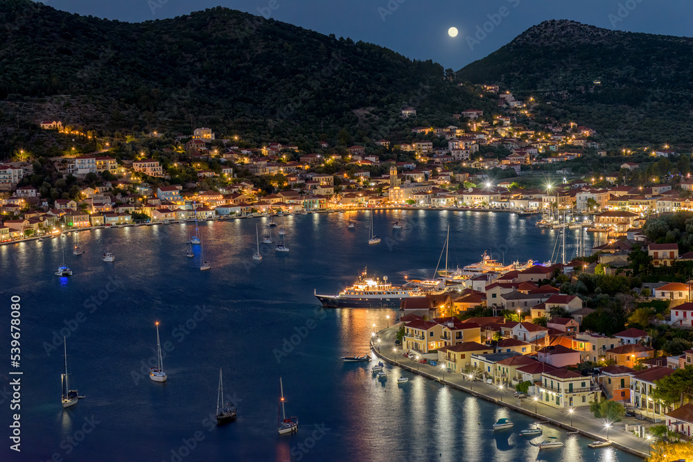 Night view with a full moon of  the picturesque port of Vathy village, the capital of Ithaca island, Ionian, Greece.