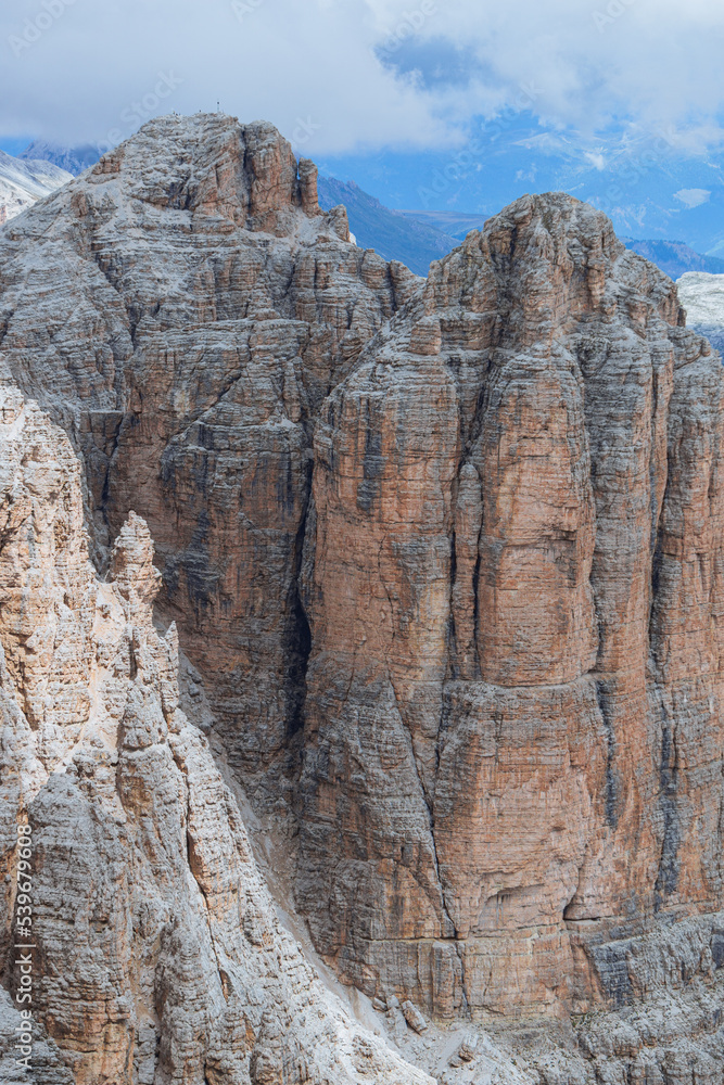 The landscape of the Dolomites seen from the Sella group: one of the most famous and spectacular mountain massifs in the Alps, near the town of Canazei, Italy - July 2022.