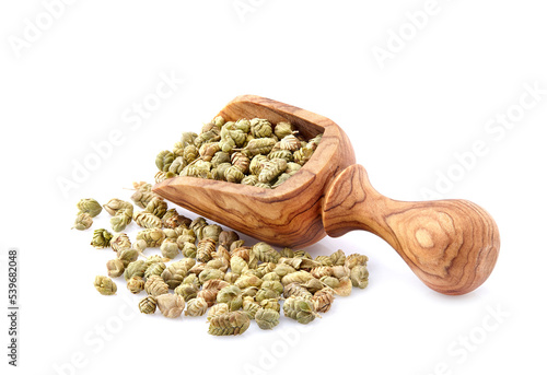 Thyme spice in wooden spoon isolated on white background. Oregano ball. Thymus vulgaris.