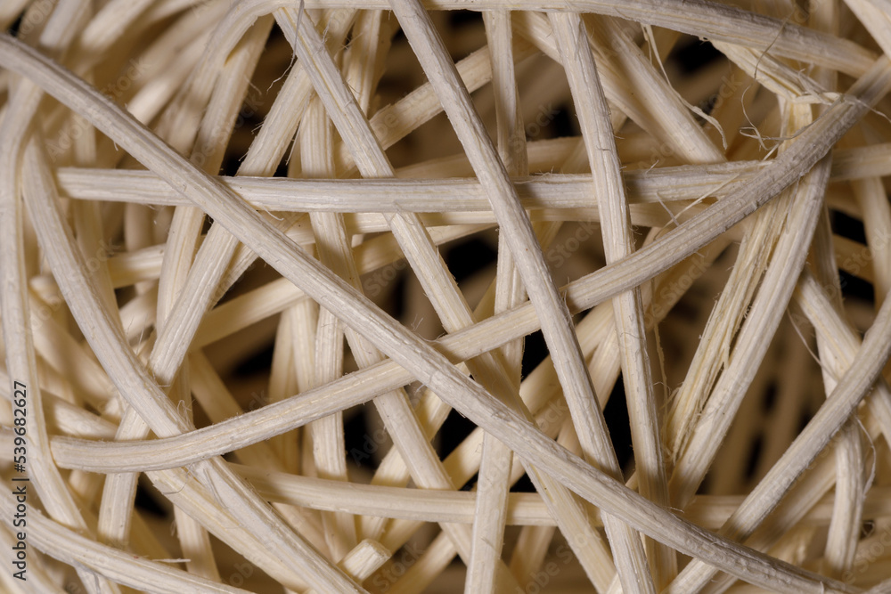 a ball woven from a wooden vine of bamboo on a black background a ball woven from a wooden vine of bamboo on a black background