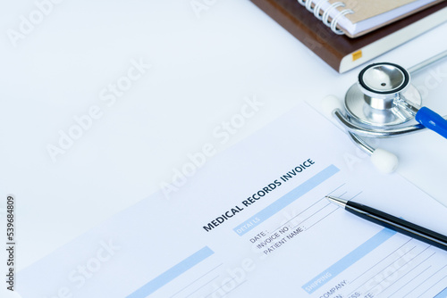 Stethoscope with medical records invoice. on white background.