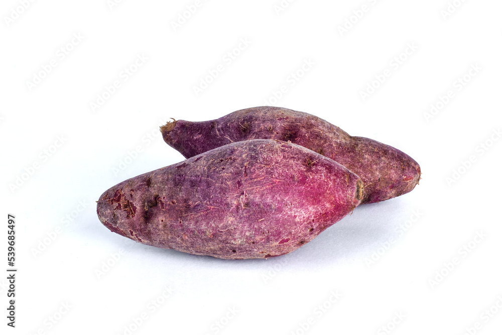 two purple sweet potatoes on white background two purple sweet potatoes on white background