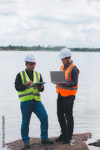 Environmental engineers work at wastewater treatment plants,Water supply engineering working at Water recycling plant for reuse,Technicians and engineers discuss work together.