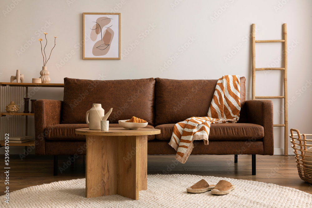 Warm and cozy interior of living room space with brown sofa round