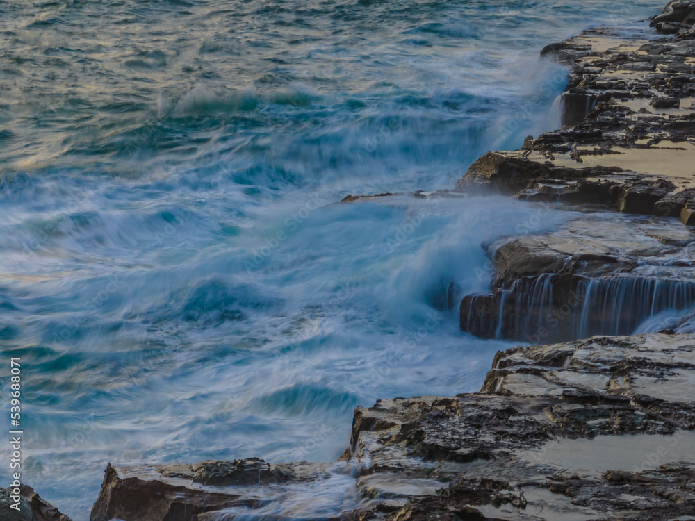 Top down rocky seascape in the sunrise light Top down rocky seascape in the sunrise light