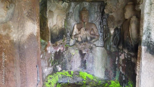 Statue Of Buddha Carved On Wall In Pandav Leni Caves In Nashik, India - approach photo