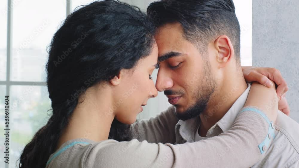 Married couple in love Indian Hispanic woman and bearded man boyfriend and girlfriend wife and husband hugging embracing cuddling touching foreheads reconcile after quarrel romantic meeting cuddle hug Married couple in love Indian Hispanic woman and bearded man boyfriend and girlfriend wife and husband hugging embracing cuddling touching foreheads reconcile after quarrel romantic meeting cuddle hug