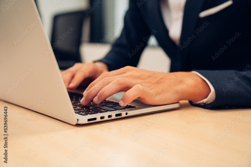 Closeup of businessman working at office, Man hands typing keyboard on laptop or computer. Closeup of businessman working at office, Man hands typing keyboard on laptop or computer.