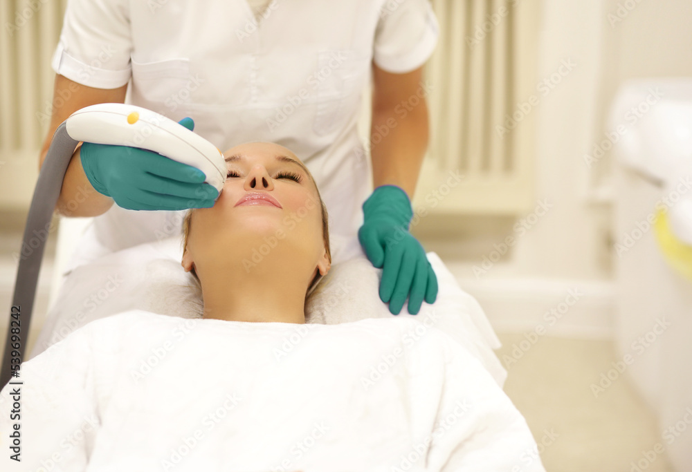 Obraz premium Photorejuvenation,Cosmetic Laser Dermatology ,dermatologist offices,laser technology.