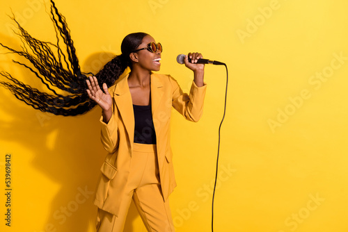 Photo of hooray millennial lady sing wear glasses suit isolated on yellow color background