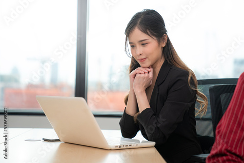 Successful asian businesswoman working and looking camera at her office desk, Concept of business risk analysis and assessment