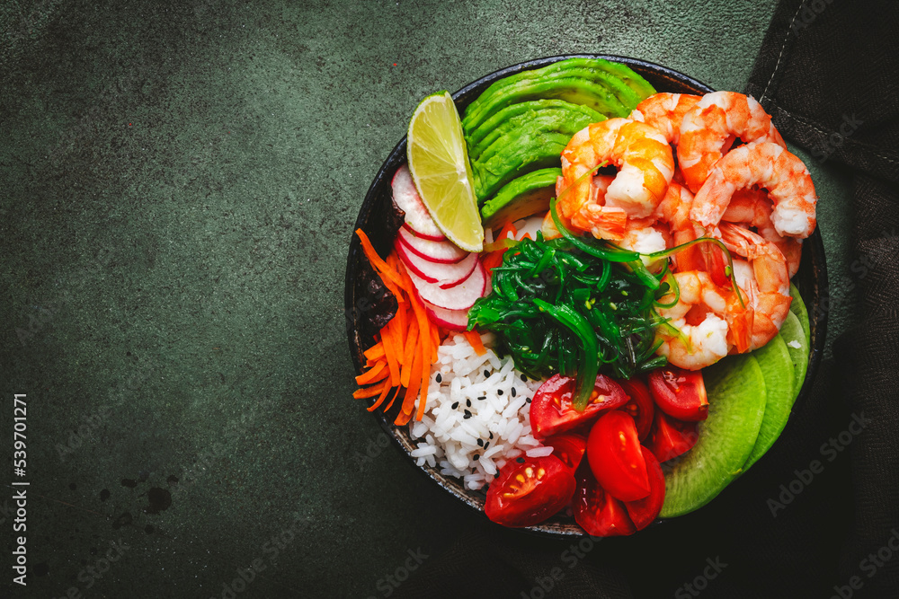 Hawaiian poke bowl with shrimp, avocado, radish, carrot, tomato, chuka