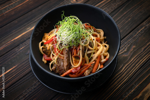 Pasta with meat, mushrooms and vegetables, with a small depth of field
