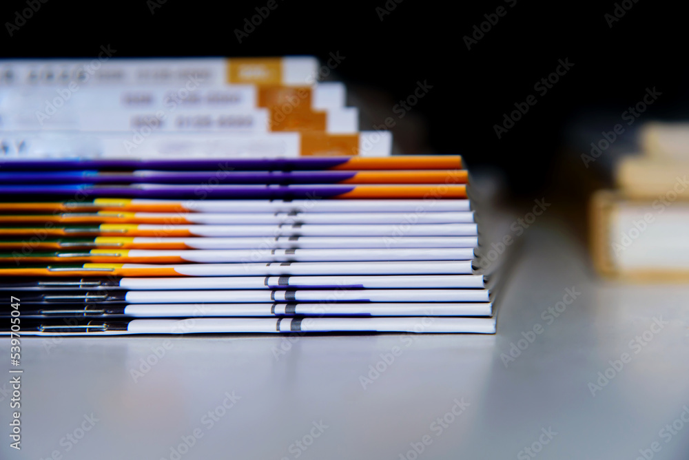 stack of books on a black background stack of books on a black background