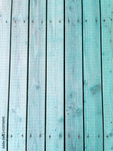 Stained green planks of wood background