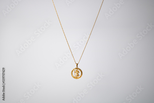 Gold necklace on grey background jewelry fashion 