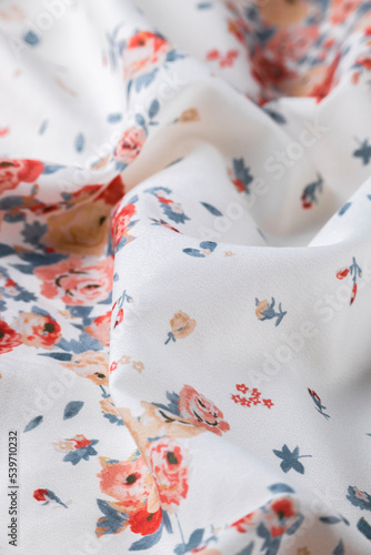 Fashionable floral cloth, ondulate modern textile close up view