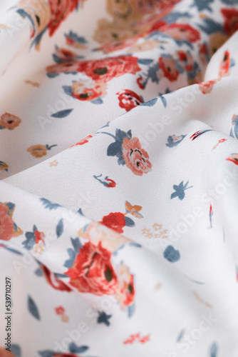Fashionable floral cloth, ondulate modern textile close up view