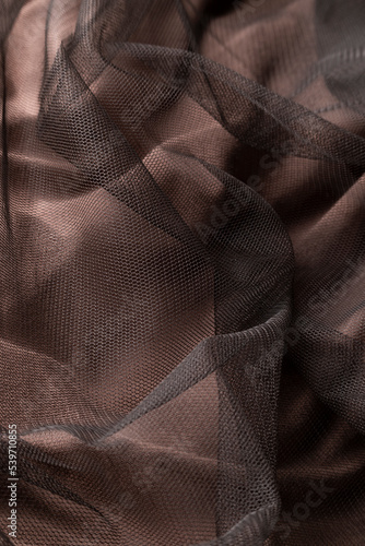Fashionable brown tulle cloth, sofisticate textile close up view