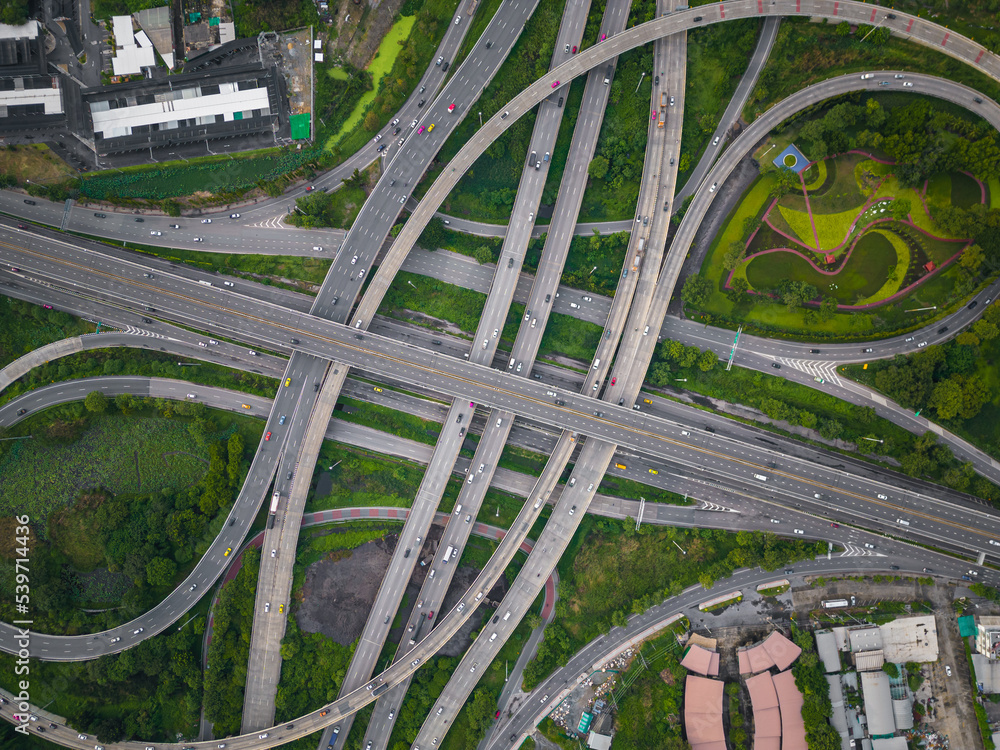 Aerial view city transport junction cross road with green public park transport industry Aerial view city transport junction cross road with green public park transport industry
